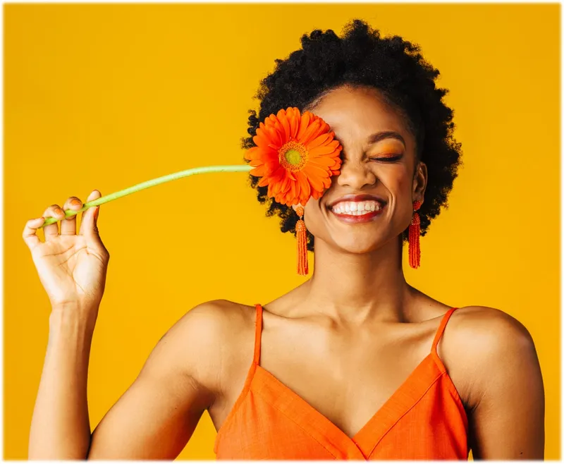 Woman holding a flower in her hand